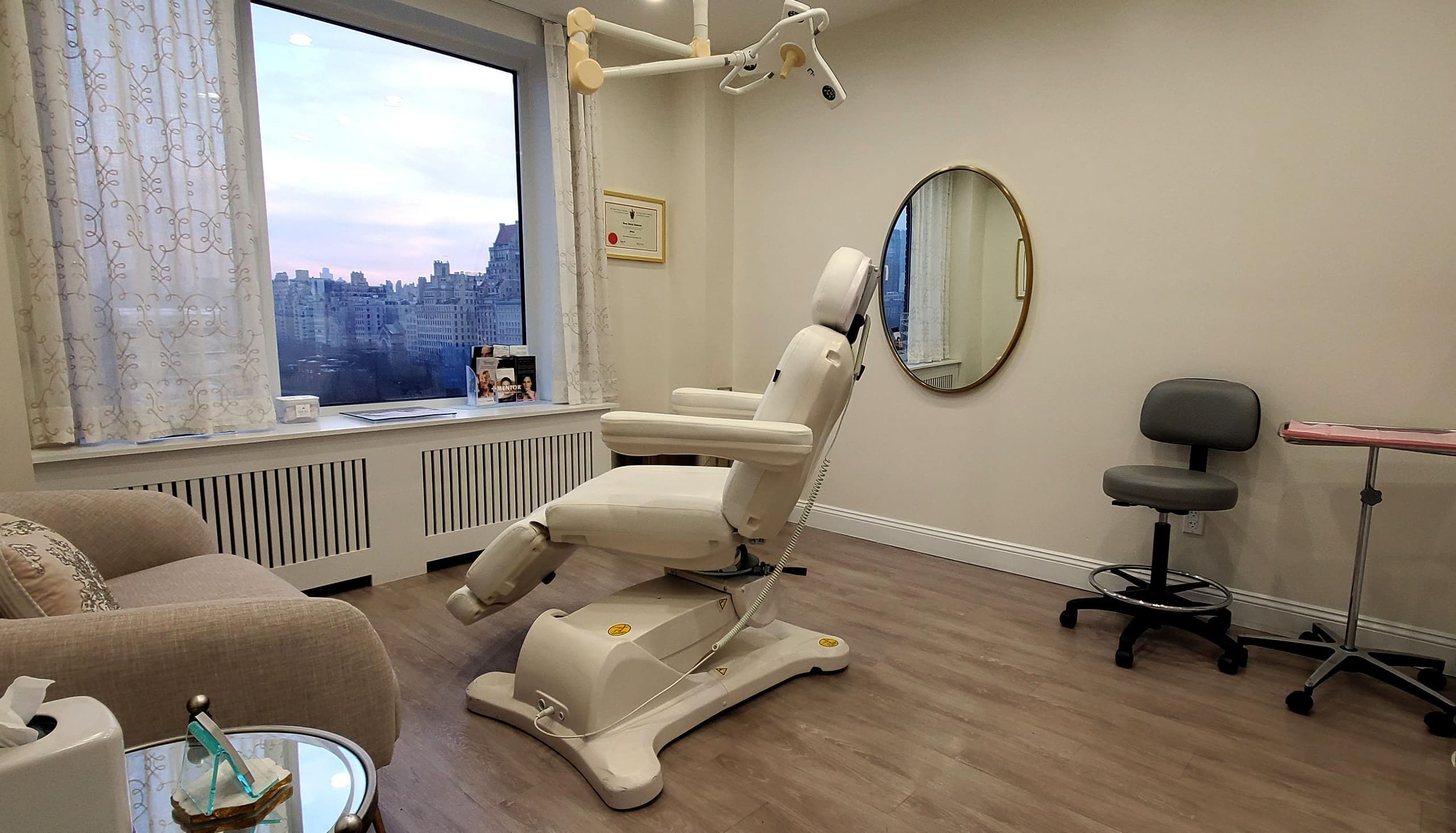 A procedure room at Hudson Face & Eye with a view over Manhattan